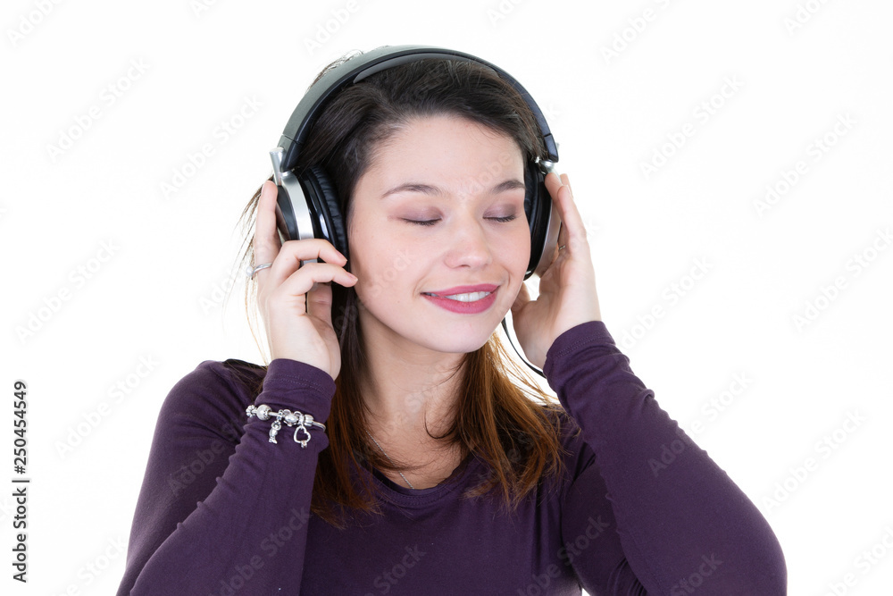 pretty portrait of young woman with closed eyes posing in professional dj headphones on white background pretty portrait of young woman with closed eyes posing in professional dj headphones on white background