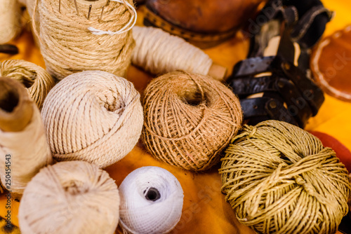Balls of yarn, wool and rope of earth colors.