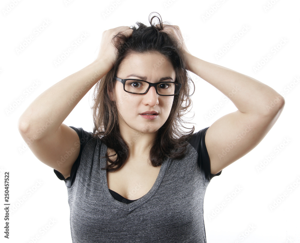anxious stressed young woman tearing her hair out