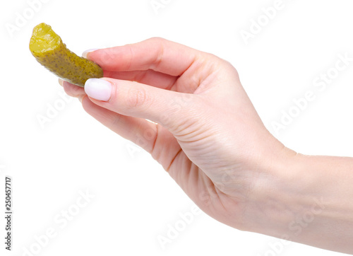 Salted cucumber in hand on a white background. Isolation