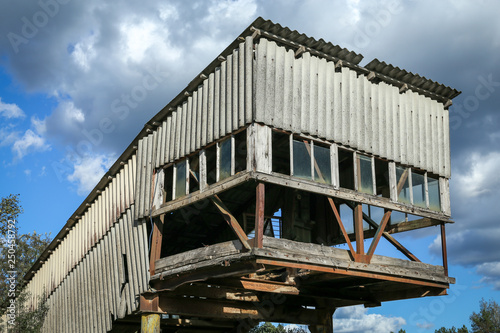 Industrial building in an old abandoned sand quarry. Image taken in summer daylight.
