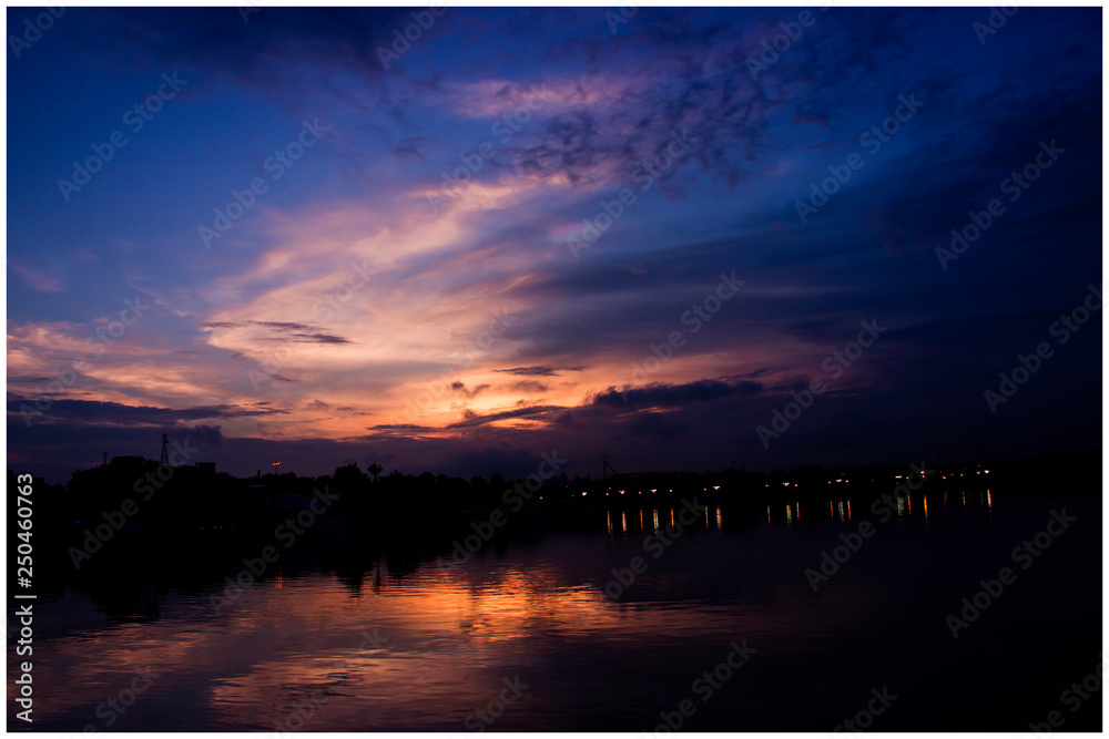 sunset over the Hussain sagar lake Stock Photo | Adobe Stock
