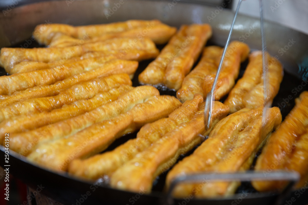 Frying Chinese Donuts Frying Chinese Donuts