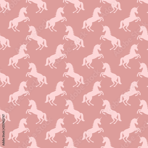 seamless pattern with unicorns. pink powder color background. vector