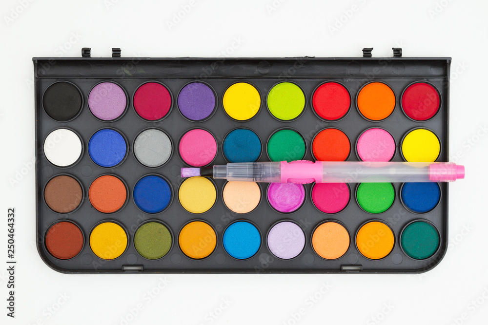 Watercolor paint kit with brush on white Watercolor paint kit with brush on white