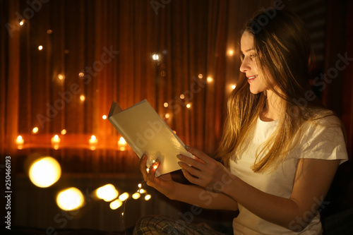 Beautiful woman reading fai...