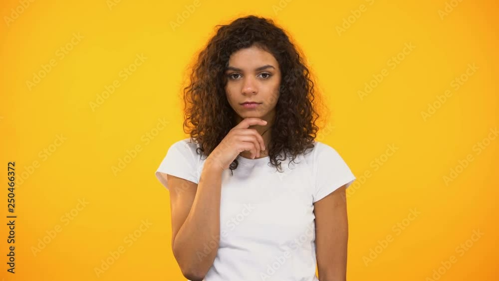 Discontent biracial lady gesturing facepalm on camera against yellow background