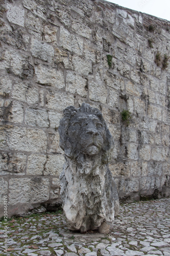 An ancient lion sculpture in the Castle of Brescia, Lombardy, Italy.