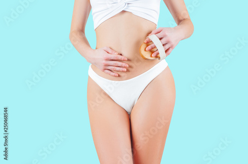 Woman with perfect body shape on pastel blue background