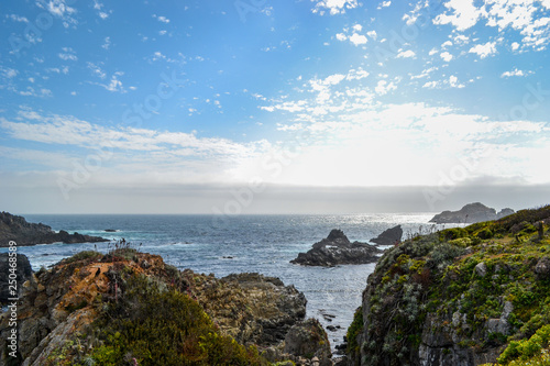 Sea cliffs in blue waters of the Pacific ocean