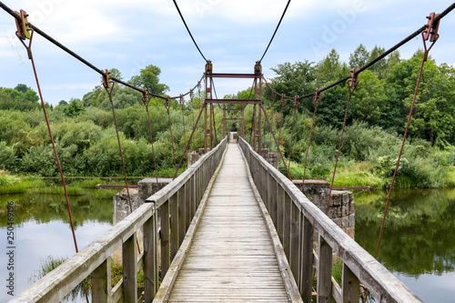 Svencele  Klaipeda county  Lithuania - August 14  2018  Wooden hanging bridge over King Wilhelm channel. Tourist destination in Klaipeda county in Lithuania.