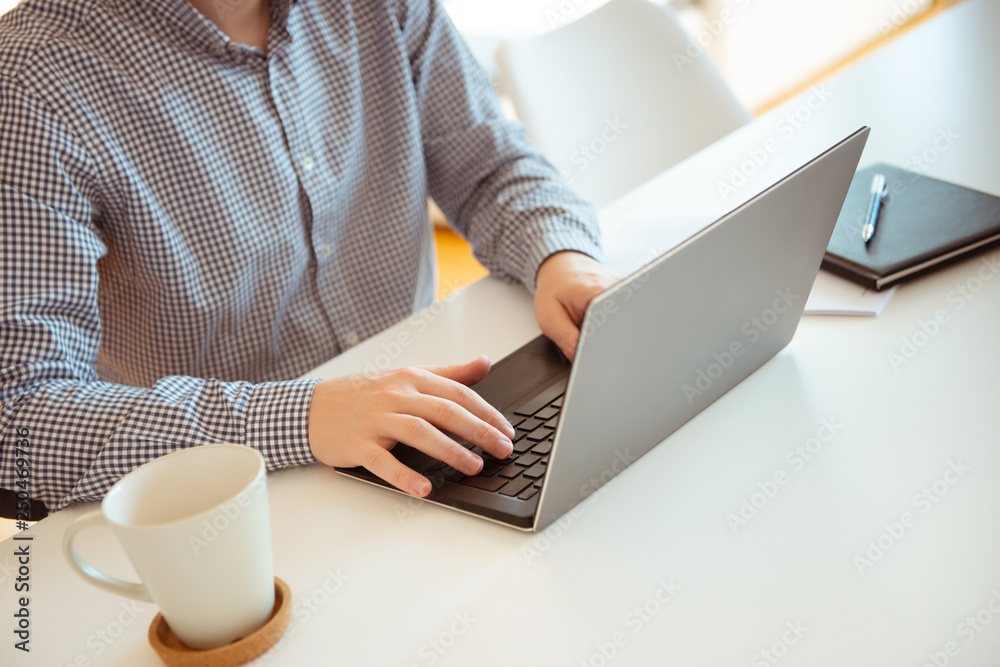 Closeup photo of man working with laptop Closeup photo of man working with laptop