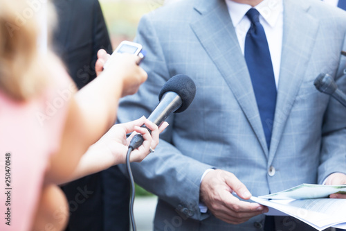 Journalists making media interview with business person or politician