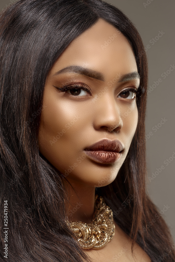 Foto de Beauty black skin woman African Ethnic female face. Young african  american model with long hair do Stock | Adobe Stock