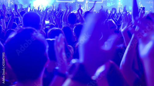 abstract colorful background audience in public concert.