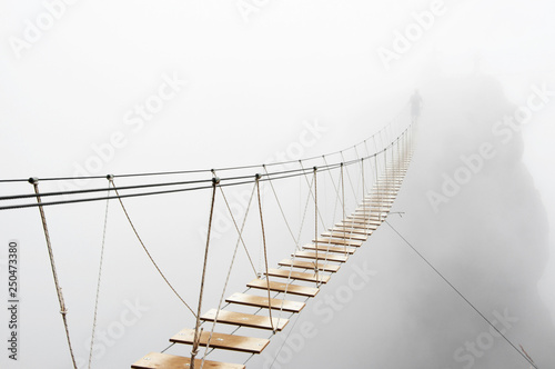 Hanging bridge in fog