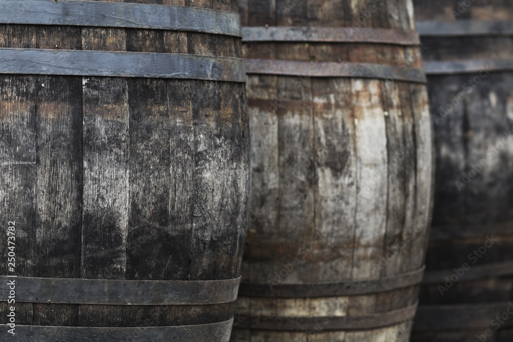 texture of old wooden wine barrels in perspective standing in a row