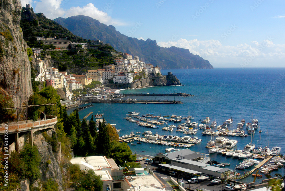 Amalfi Coastline and harbor with blue waters on a gorgeous day.