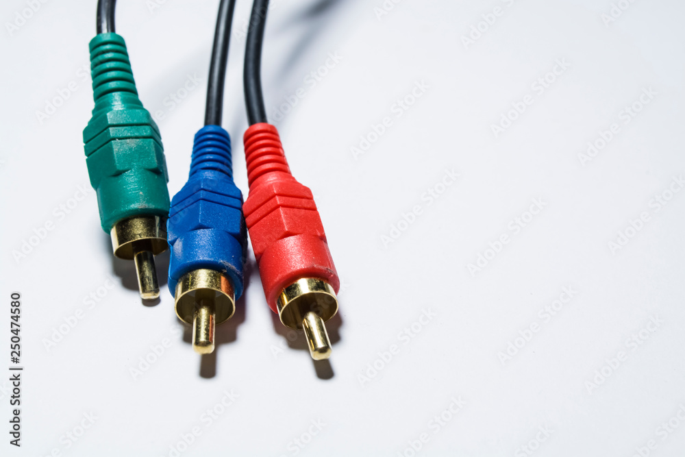 White background. Several black wires with plugs. TV cable, multimedia. Tulip. Different color. Electronics.