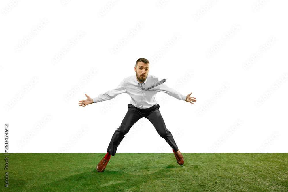 Full length shot of a young businessman playing football isolated on white background. Full length shot of a young businessman playing football isolated on white background.