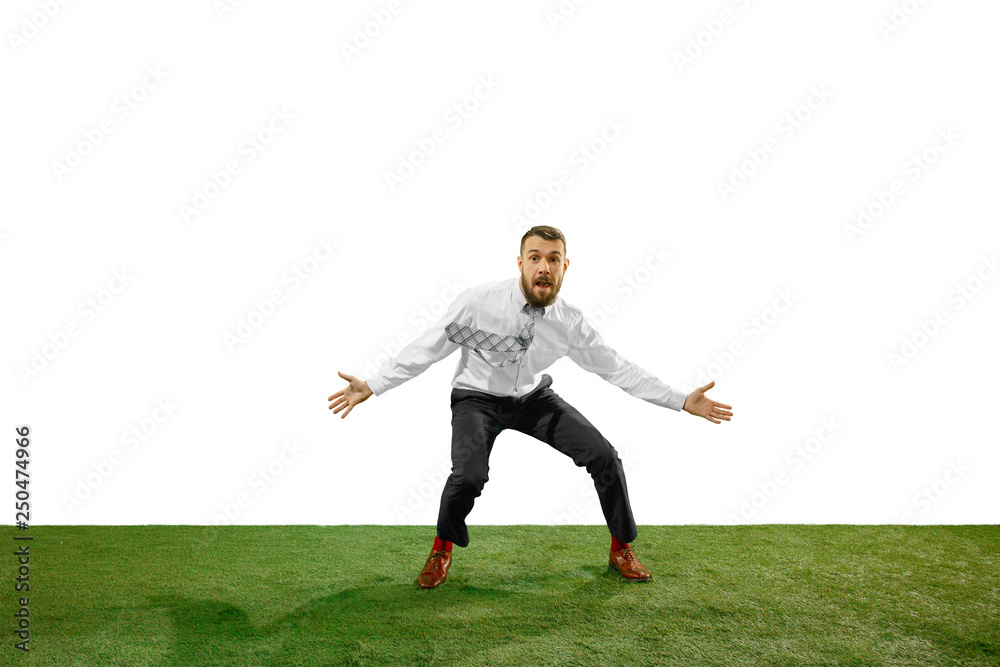 Full length shot of a young businessman playing football isolated on white background. Full length shot of a young businessman playing football isolated on white background.