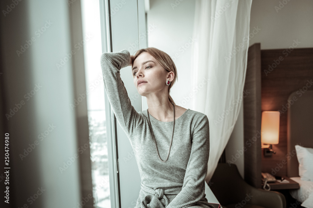 Woman feeling relieved after coming home after work Woman feeling relieved after coming home after work