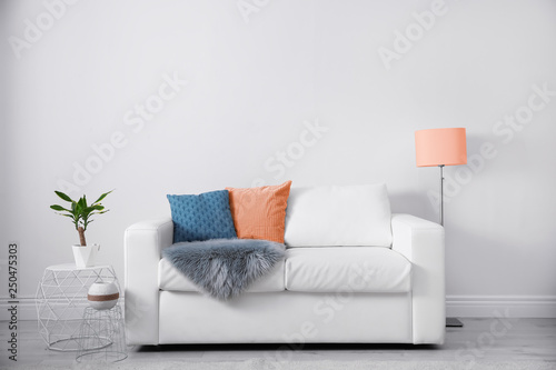 Modern living room interior with orange elements. Space for text