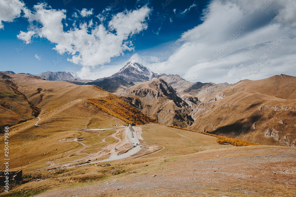 Caucasian mountains. A view of snow-covered summit of Mount Kazbegi, Caucasian mountains. A view of snow-covered summit of Mount Kazbegi,