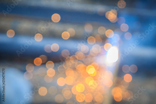 Abstract blurred focus with bokeh of steel welding with sparks. Blurry of welding for industrial concept.