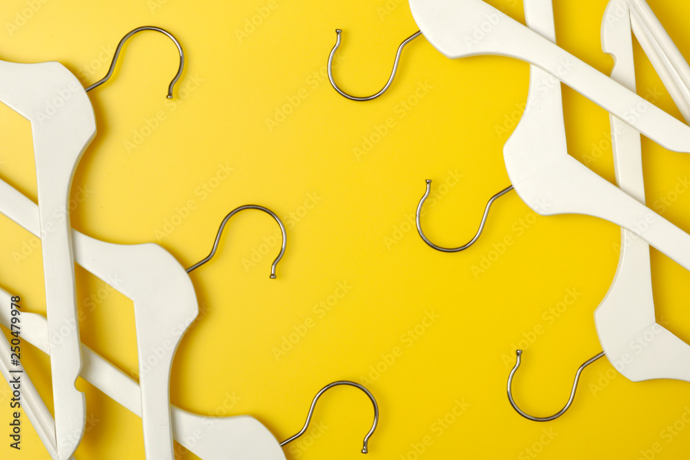 Clothes hanger on yellow background. Soft focus. Store concept, sale,  design, empty  Banner background. Stock of empty clothes  hanger (selective focus) Plastic clothes hanger. Stock Photo | Adobe Stock