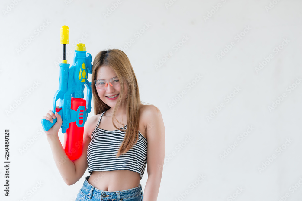 Asian sexy woman with water in hand on white background,Festival songkran day at thailand,The best of festival of thai,Land of smile Asian sexy woman with water in hand on white background,Festival songkran day at thailand,The best of festival of thai,Land of smile