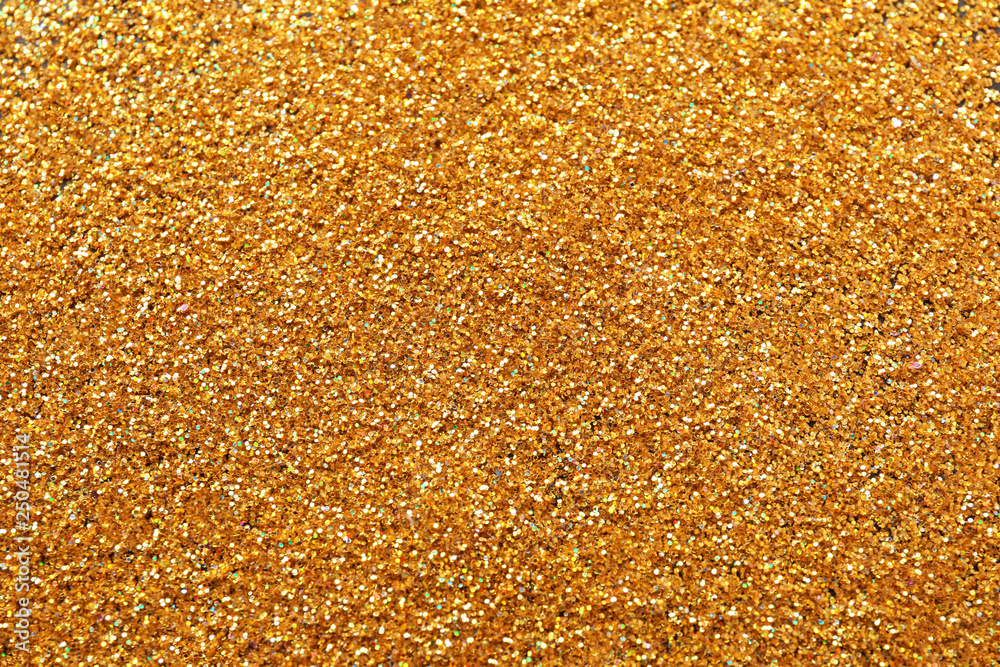 Texture of gold glitter as background, closeup