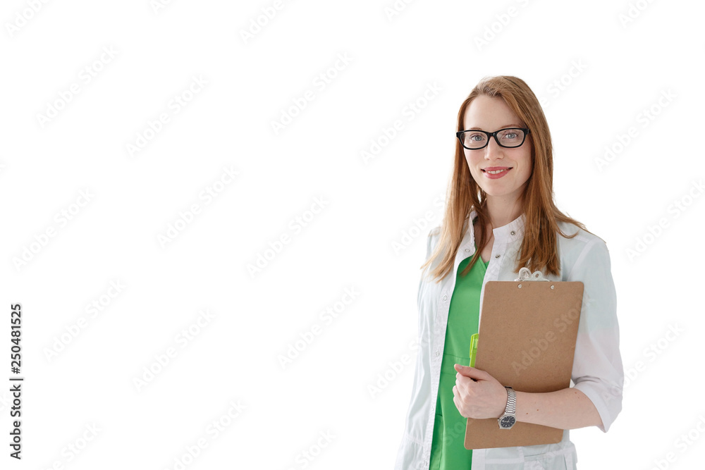 Portrait of friendly female doctor in medical gown with clipboard isolated on white background.