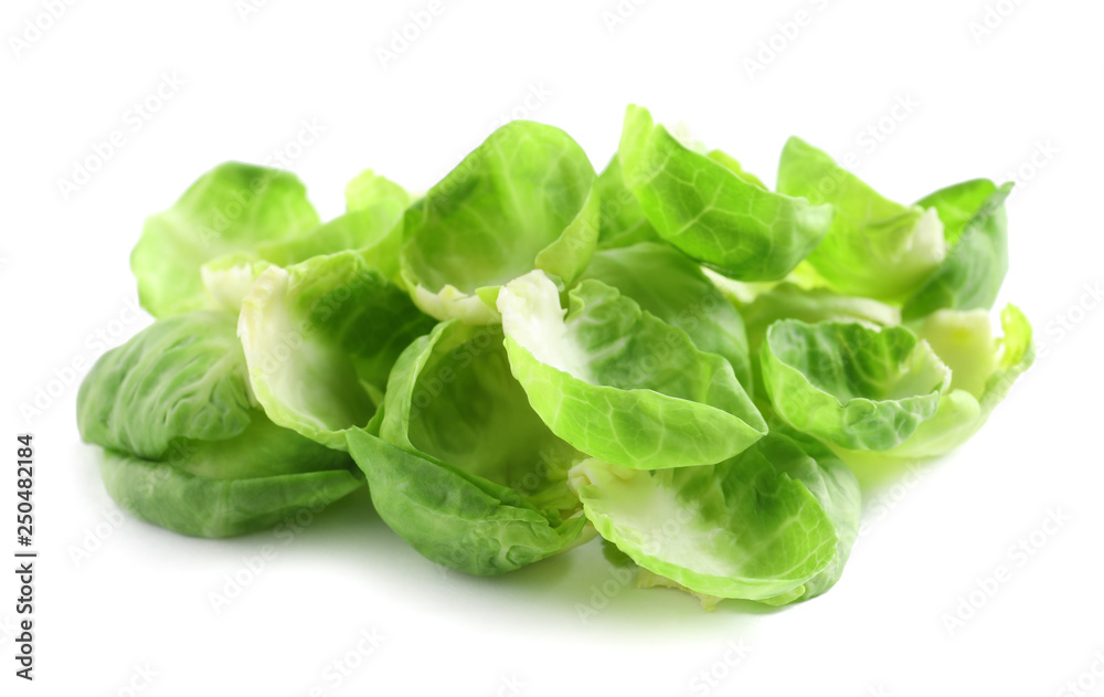 Obraz premium Leaves of fresh Brussels sprouts isolated on white