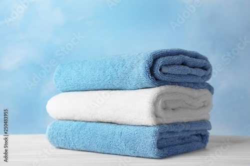 Stack of soft bath towels on table