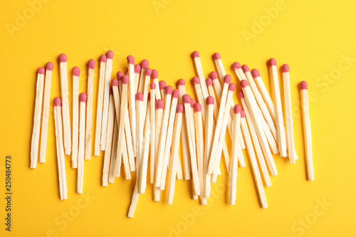 Wooden matches on color background  flat lay