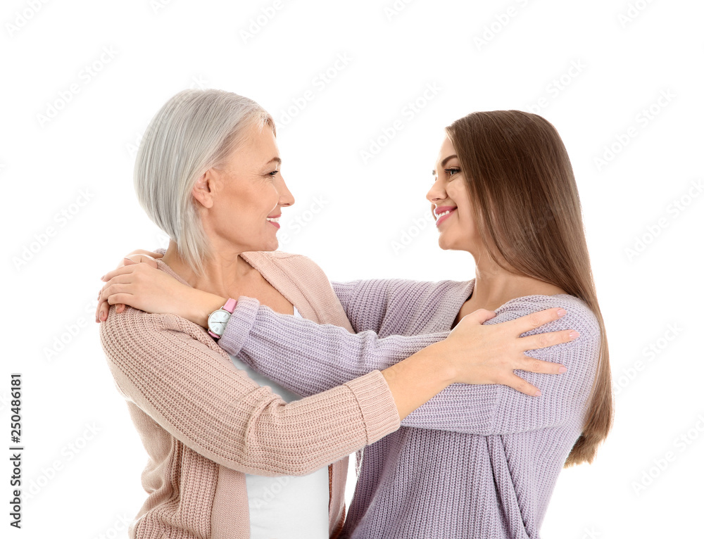Portrait of young woman with her mature mother on white background Portrait of young woman with her mature mother on white background