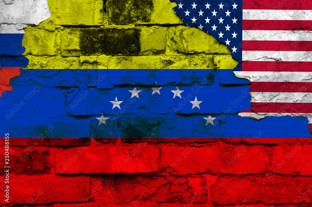 Flag of Venezuela, Russia and the USA on a brick wall background with broken plaster Flag of Venezuela, Russia and the USA on a brick wall background with broken plaster