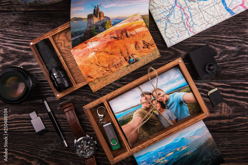 Wooden photo box with photo from travel. Decorated with different things. Travel concept.