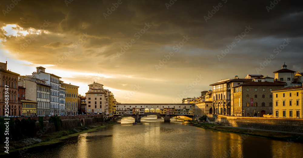 Ponte Vecchio in Florence, Italy at a cloudy sunset