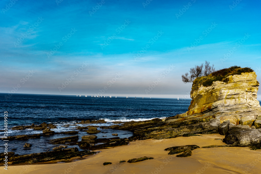 Sunset in Playa del Camello beach Santander Spain