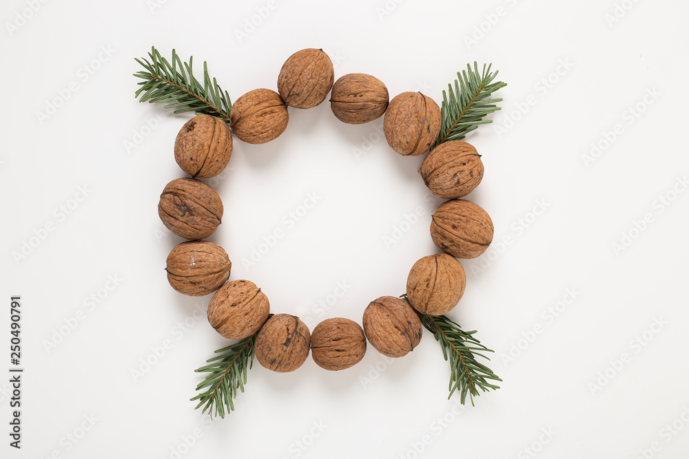 Wallnuts arranged in a circle as round decorative wreath