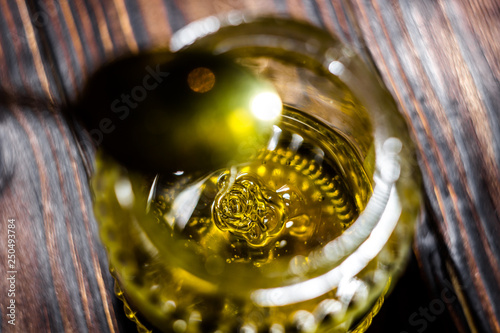 Honey spoon over glass jar