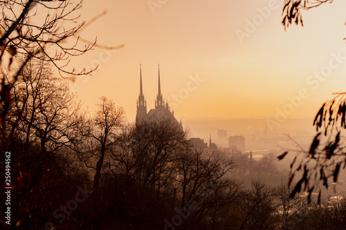 View of old city in fog at sunrise. City of Brno czech republic - Cathedral of St. Peter and Paul.