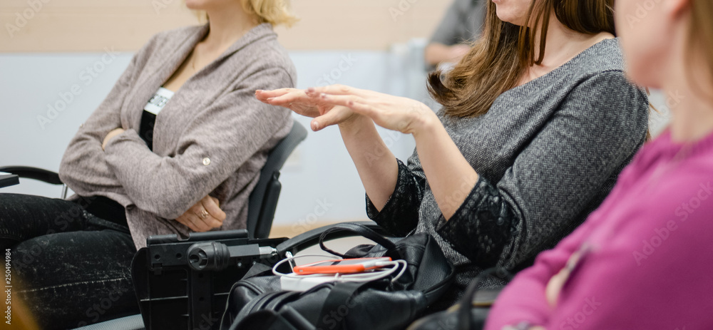 A woman sits at a lecture, presentation. A woman sits at a lecture, presentation.