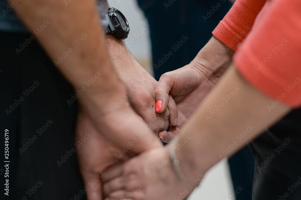 Women's hands in male hands.