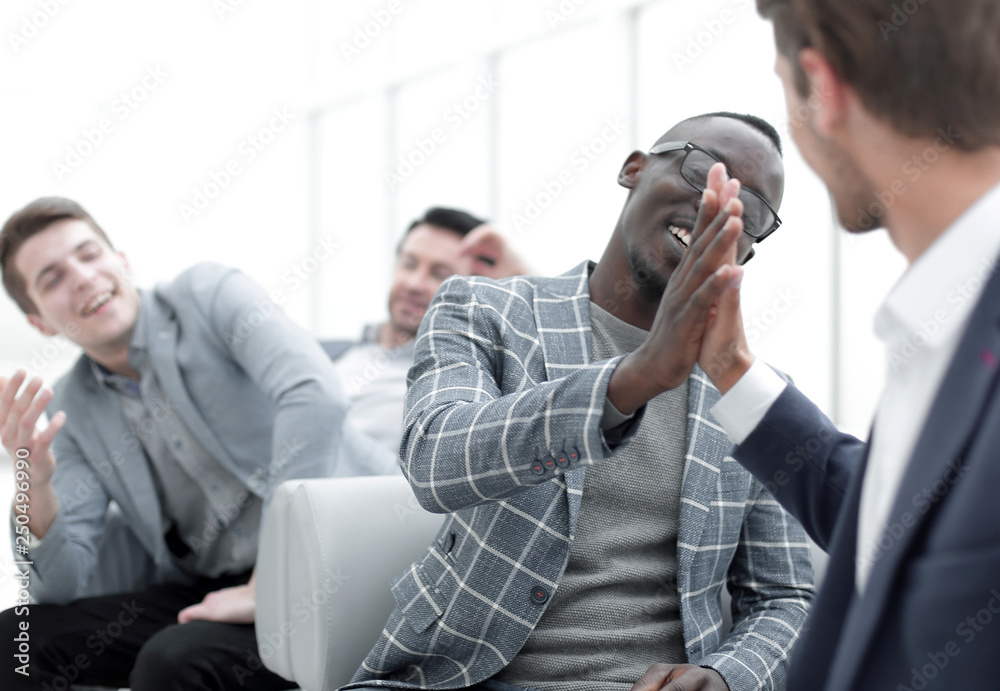 Fototapeta premium business people giving each other high five.