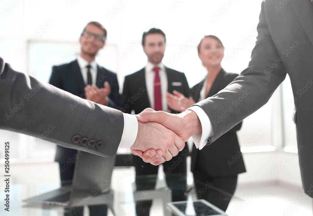 Fototapeta premium business handshake over blurry background office