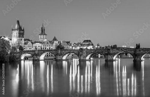 Scenic view on Vltava rive, Charles bridge and historical center of Prague, buildings and landmarks of old town at sunset, Prague, Czech Republic