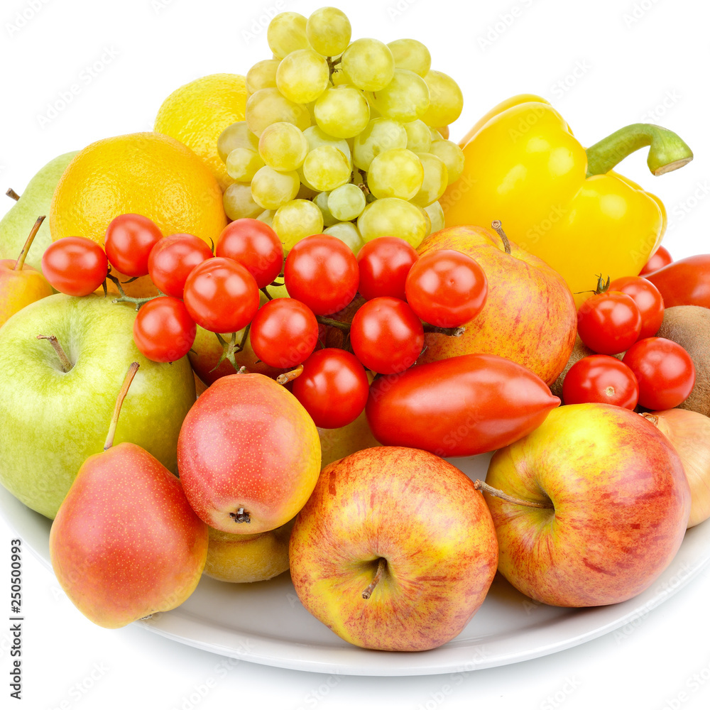 Fruits and vegetables on a platter isolated on white background. Fruits and vegetables on a platter isolated on white background.